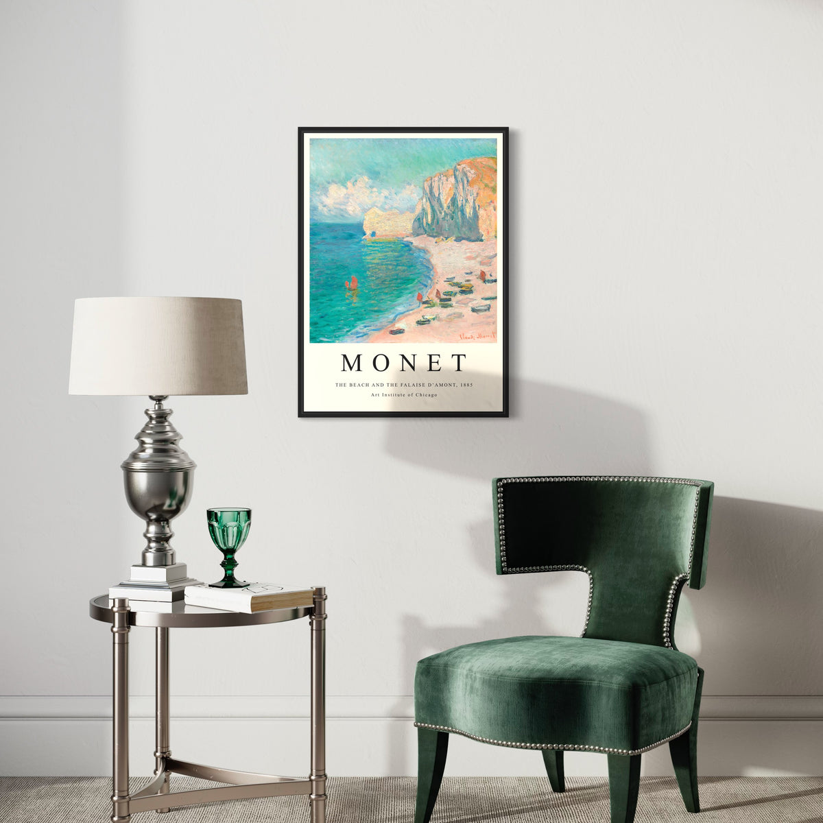 Framed Monet coastal art poster on modern living room wall with green accent chair and lamp.