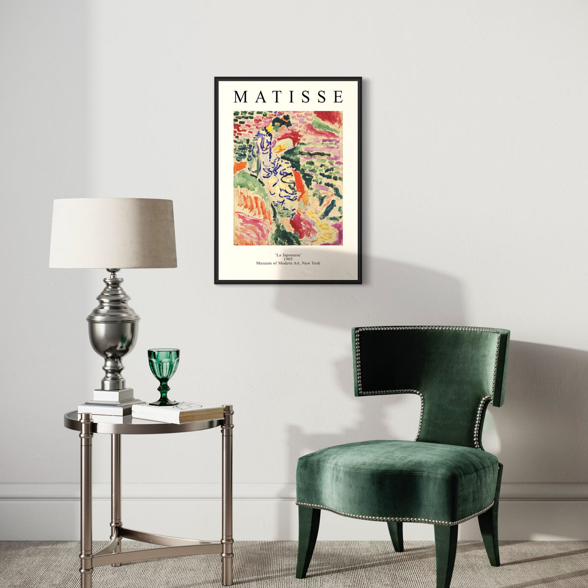 Modern living room with a Matisse art poster, green velvet chair, metal side table, and lamp