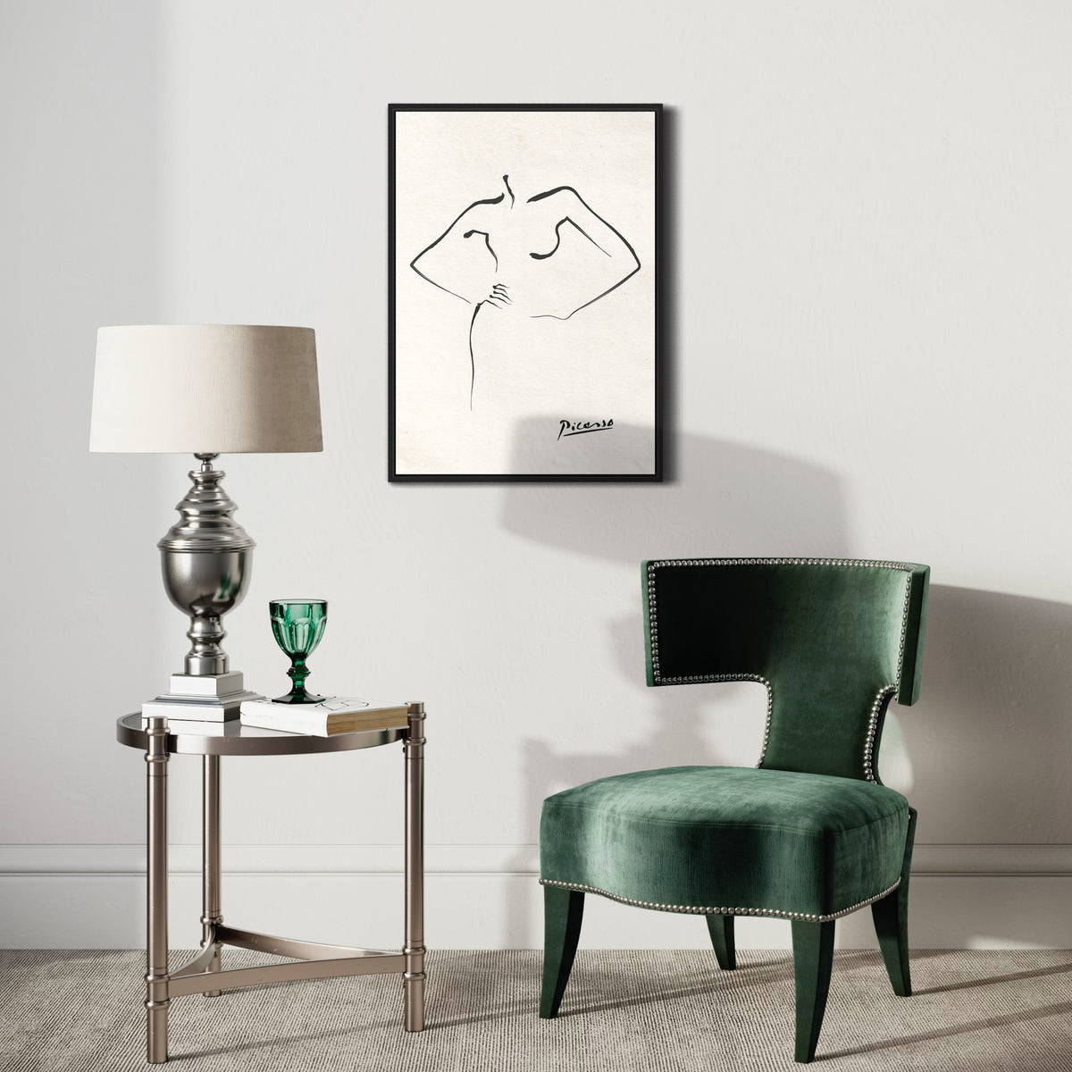 Minimalist line art poster of a torso on wall above modern green chair and silver lamp table