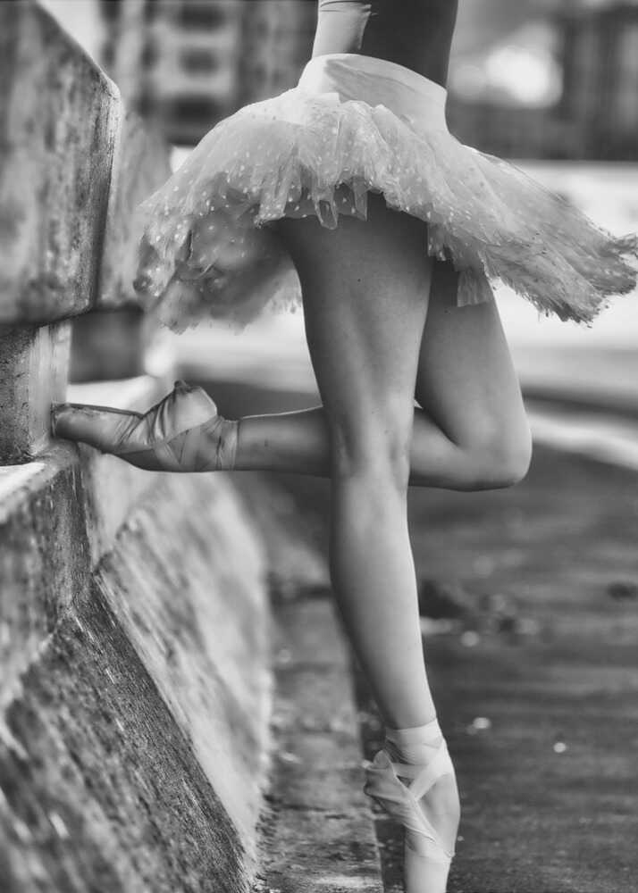 Ballerina legs poster with a black and white view of a ballerina's legs and tutu