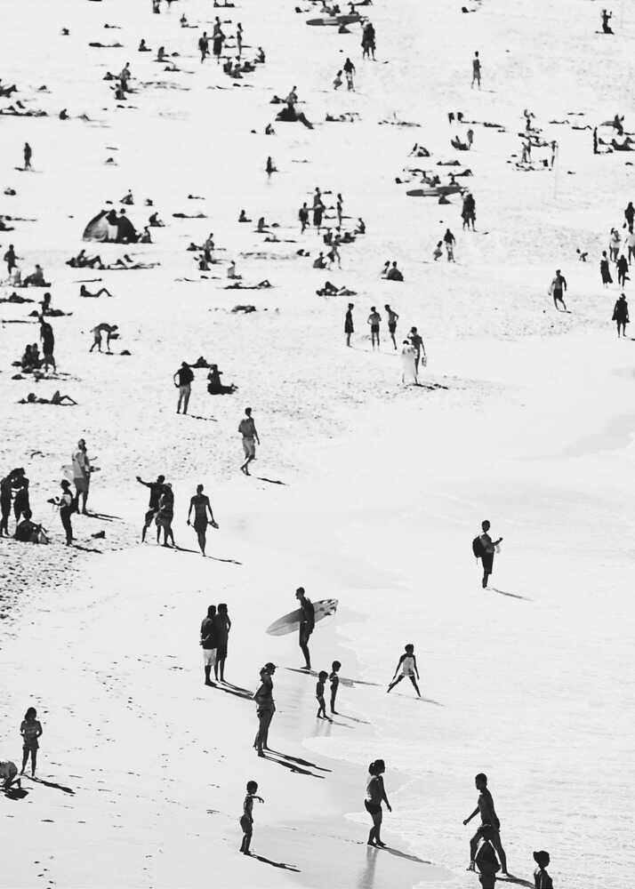 Beach crowd mockup poster with a black and white beach scene with people and surfers hanging on the wall