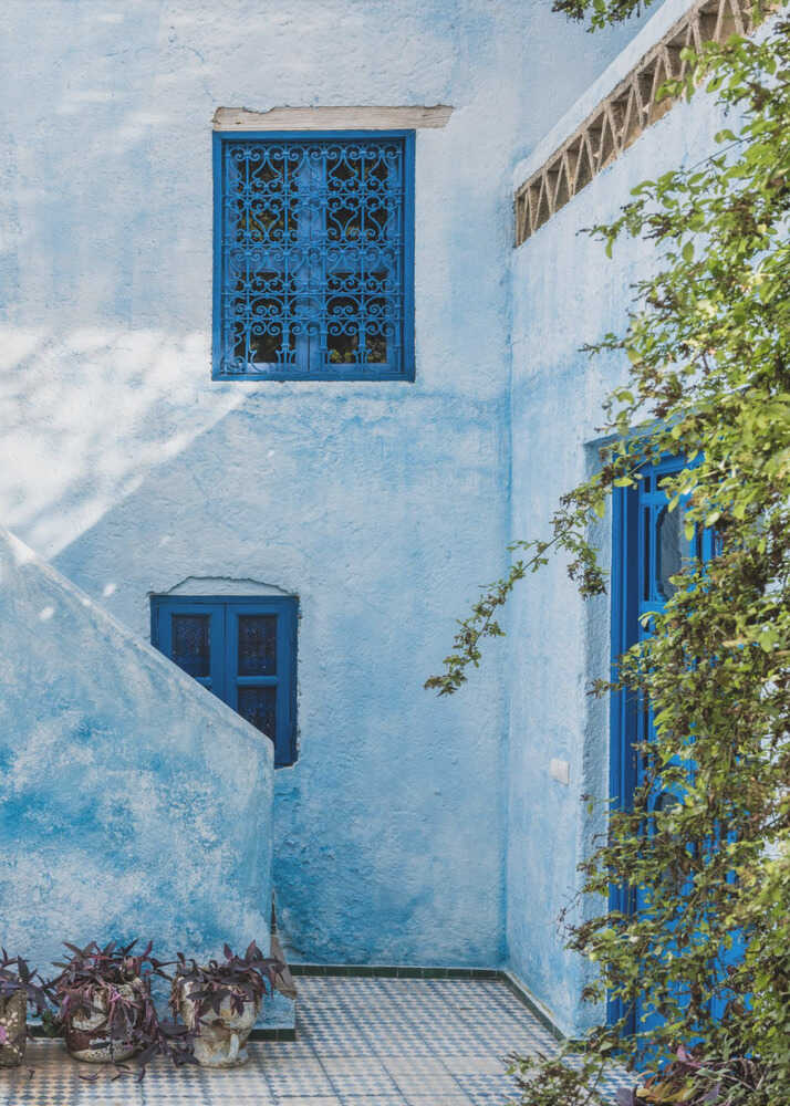 Blue Moroccan courtyard poster with blue walls, blue window grilles and blue doors