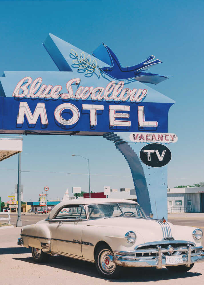 Blue Swallow Motel poster with a vintage white car under the Blue Swallow Motel sign