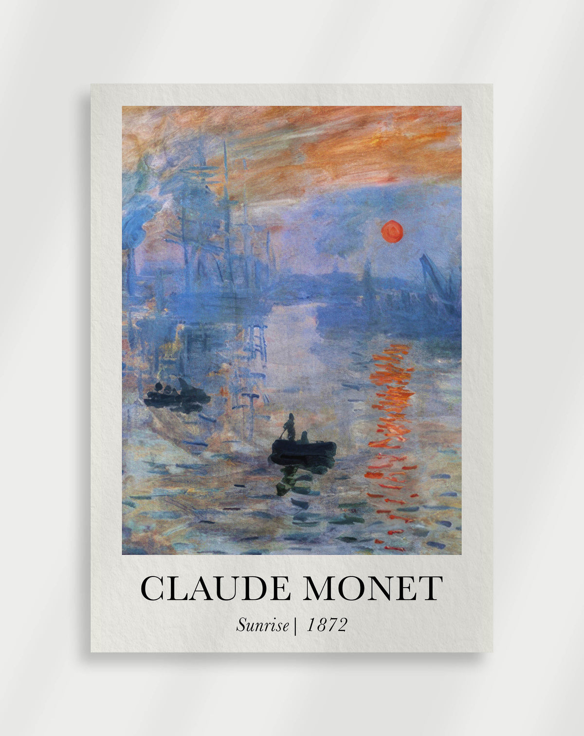 A poster of Claude Monet's painting 'Sunrise' showing a serene water scene with a reflection of the sun.