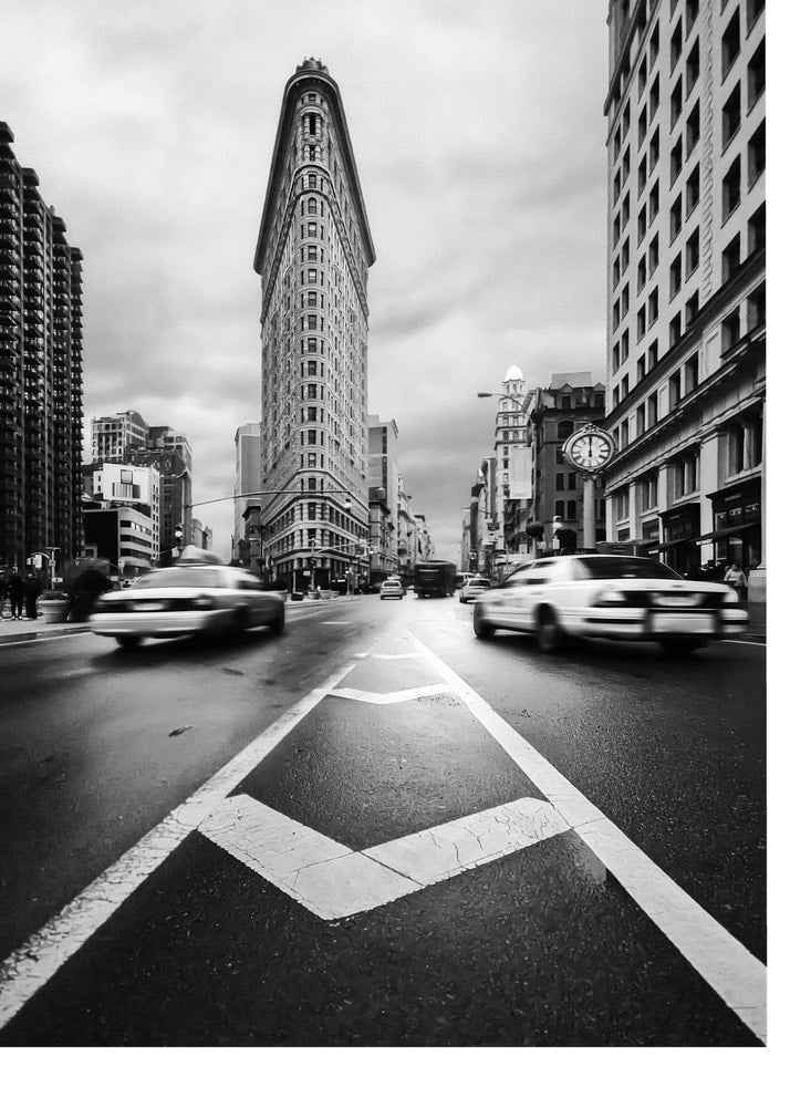 Flatiron Building poster with a black and white street view of the Flatiron Building and cars