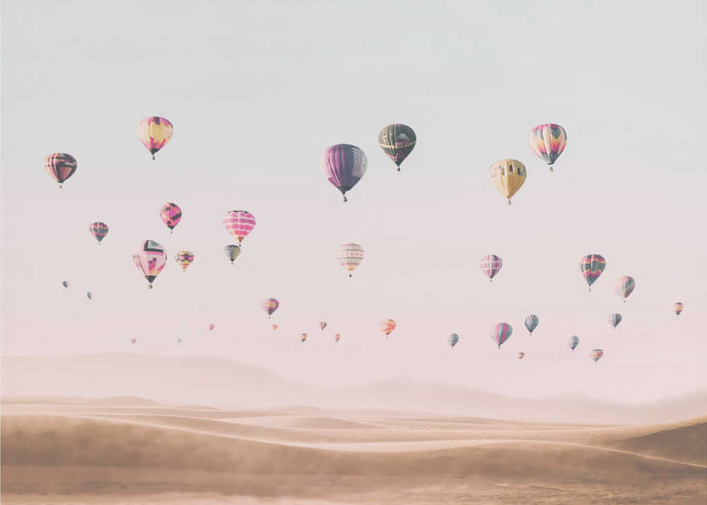 Hot air balloons desert poster with many colorful hot air balloons over a desert landscape