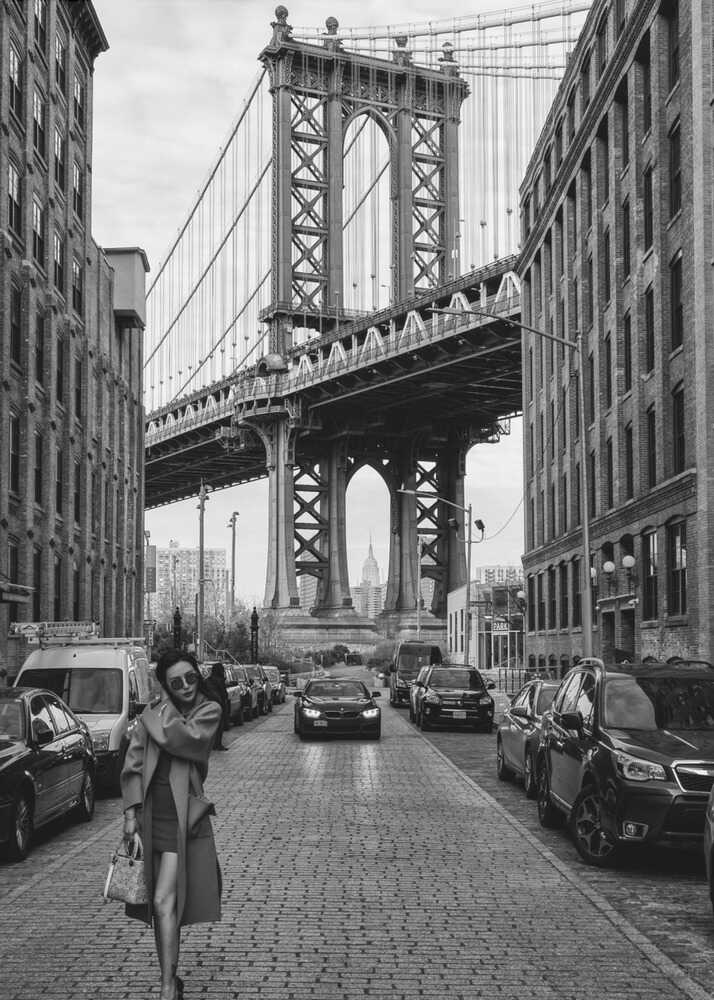 Manhattan Bridge poster with a black and white street view of the Manhattan Bridge and a woman walking
