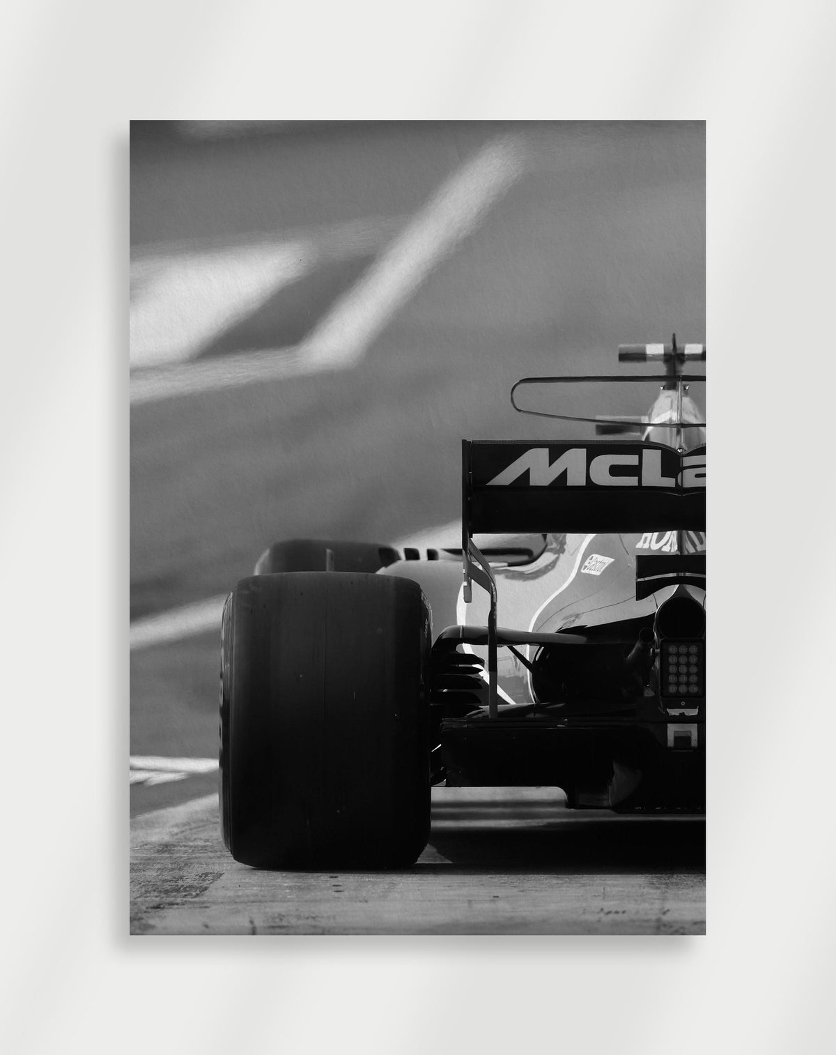 McLaren F1 poster with a black and white view of the rear of a McLaren Formula 1 car