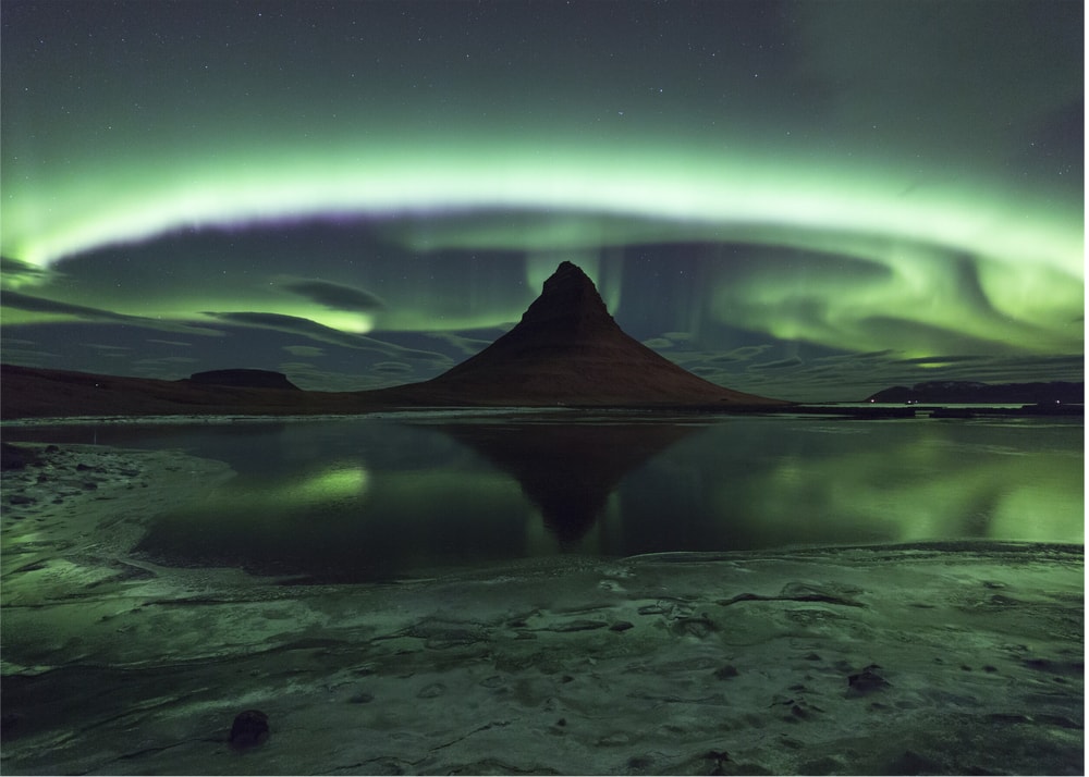 Northern lights mountain poster with green aurora over a mountain reflected in water