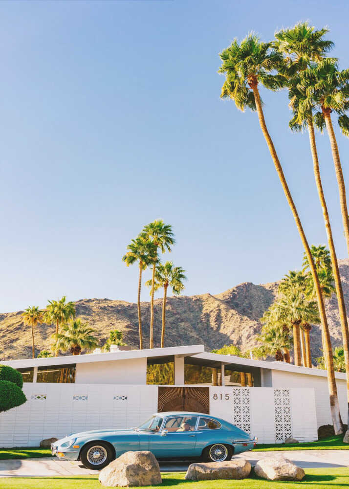 Palm Springs house poster with a light blue classic car in front of a white mid-century house and palm trees