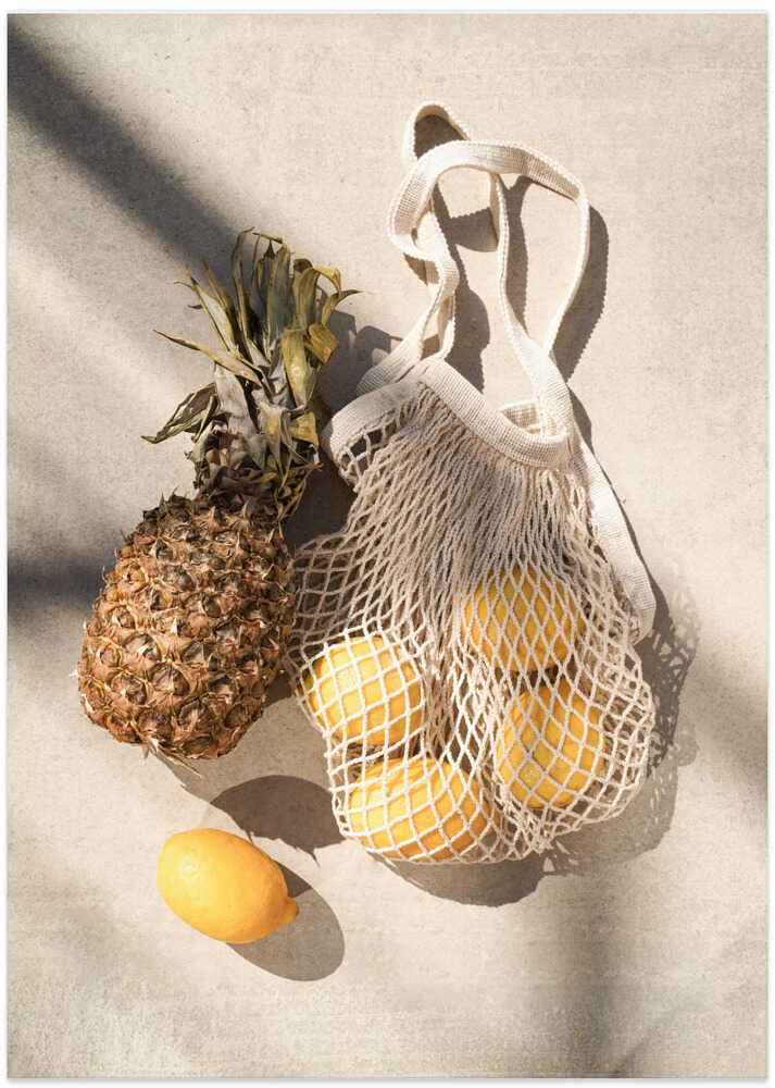 Pineapple lemons poster with a pineapple and lemons in a net bag on a beige surface