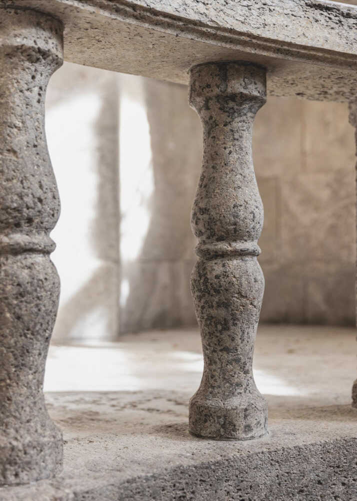 Stone balusters poster with close-up stone balusters under a stone bench