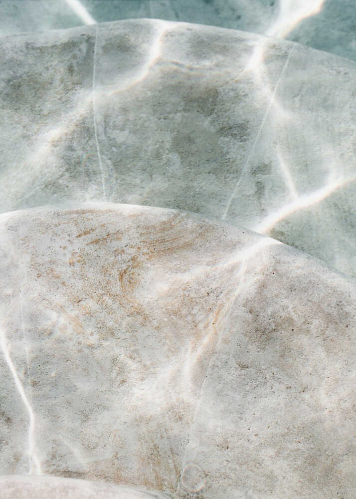 Water light poster with a close-up of water surface with light reflections and ripples